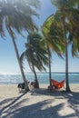 Playa giron, Cuba Ã¢â¬â January 2, 2017: Travelers relaxing on hammocks with bikes on tropical beach in Cuba, travel concept